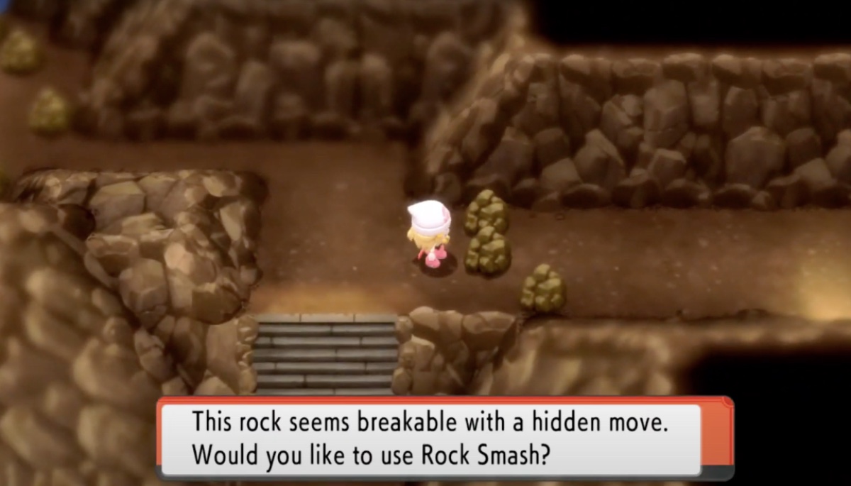 A trainer using rock smash in pokemon brilliant diamond
