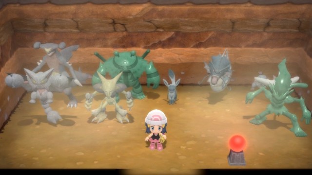 A pokemon trainer standing with statues in pokemon brilliant diamond
